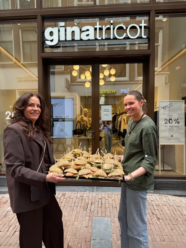 Outmayer team delivering a tray of fresh sandwiches in Amsterdam city centre